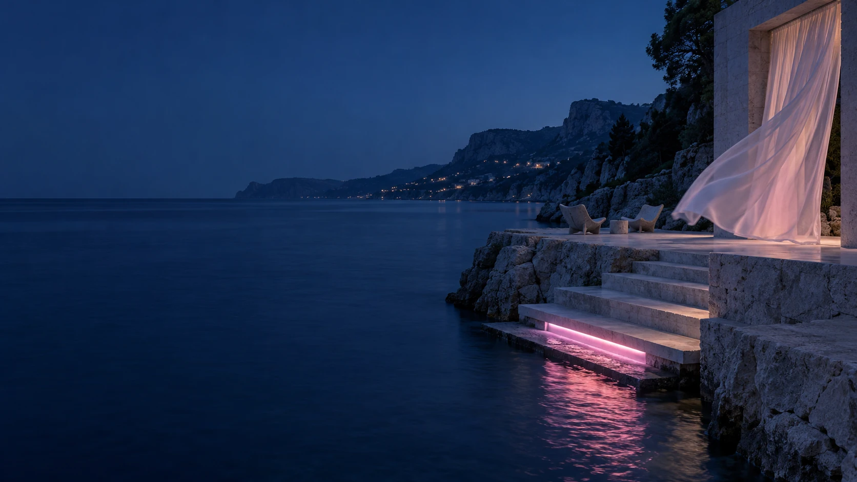 Blue-hour sea beside a limestone terrace, with two empty chairs, a billowing curtain, and a single pink light reflected in the water.